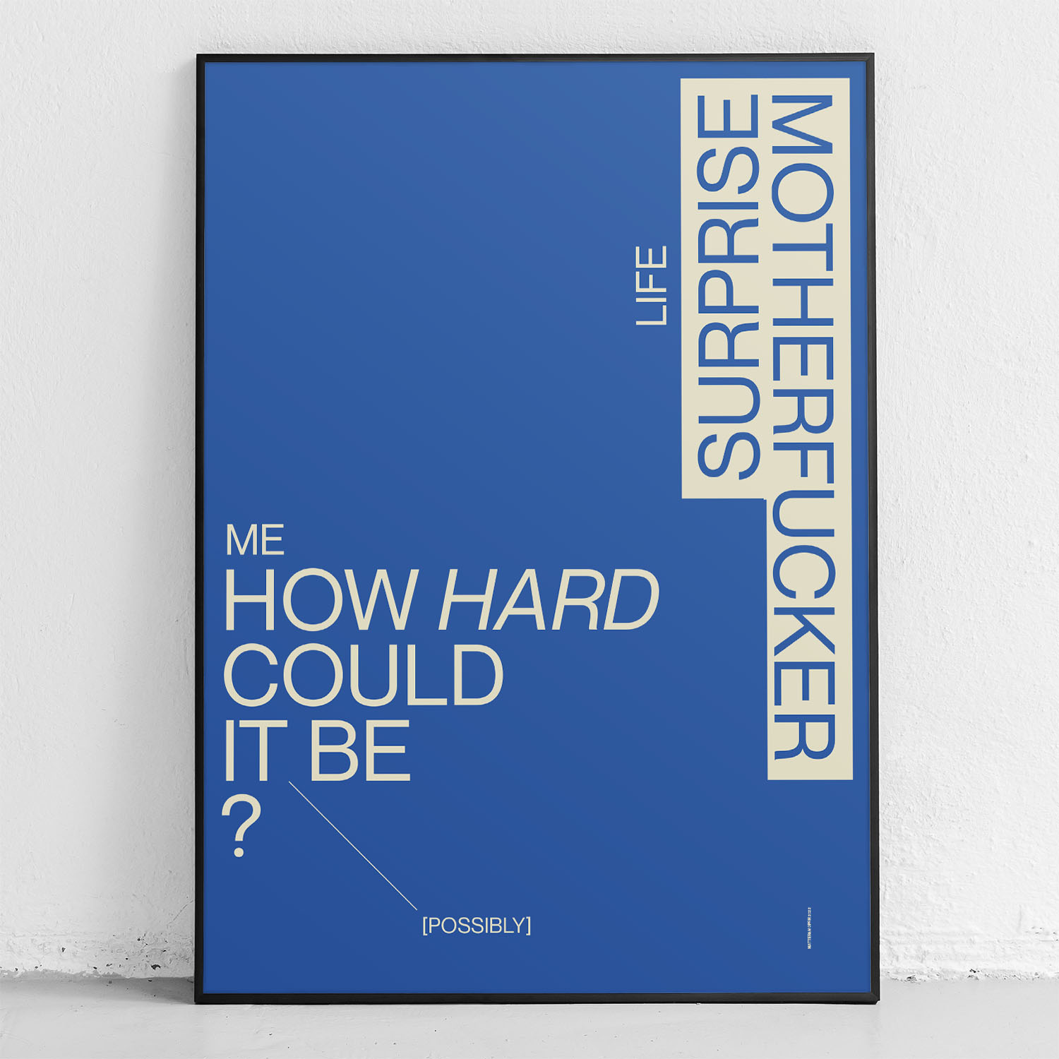 framed poster "how hard could it be" in front of wall