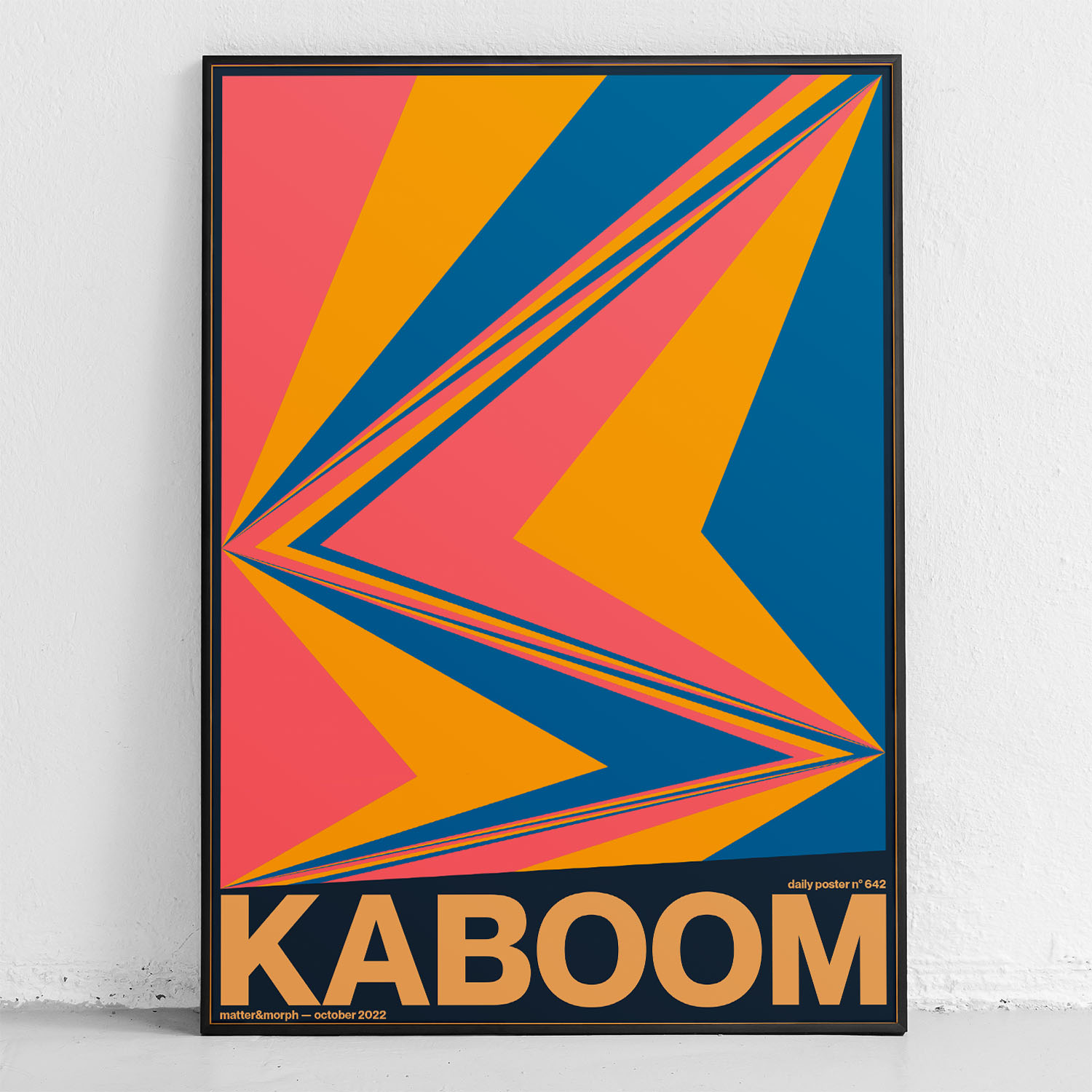 framed poster "Kabooom" in front of wall