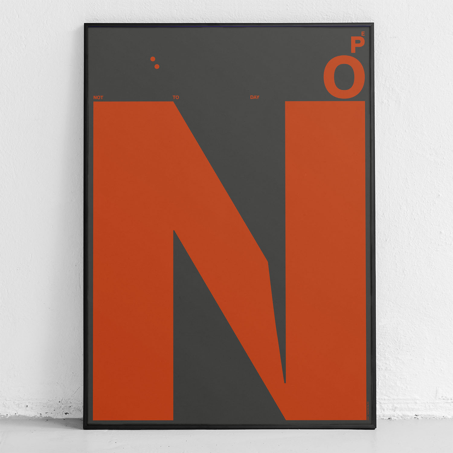 framed poster "nope" in front of wall