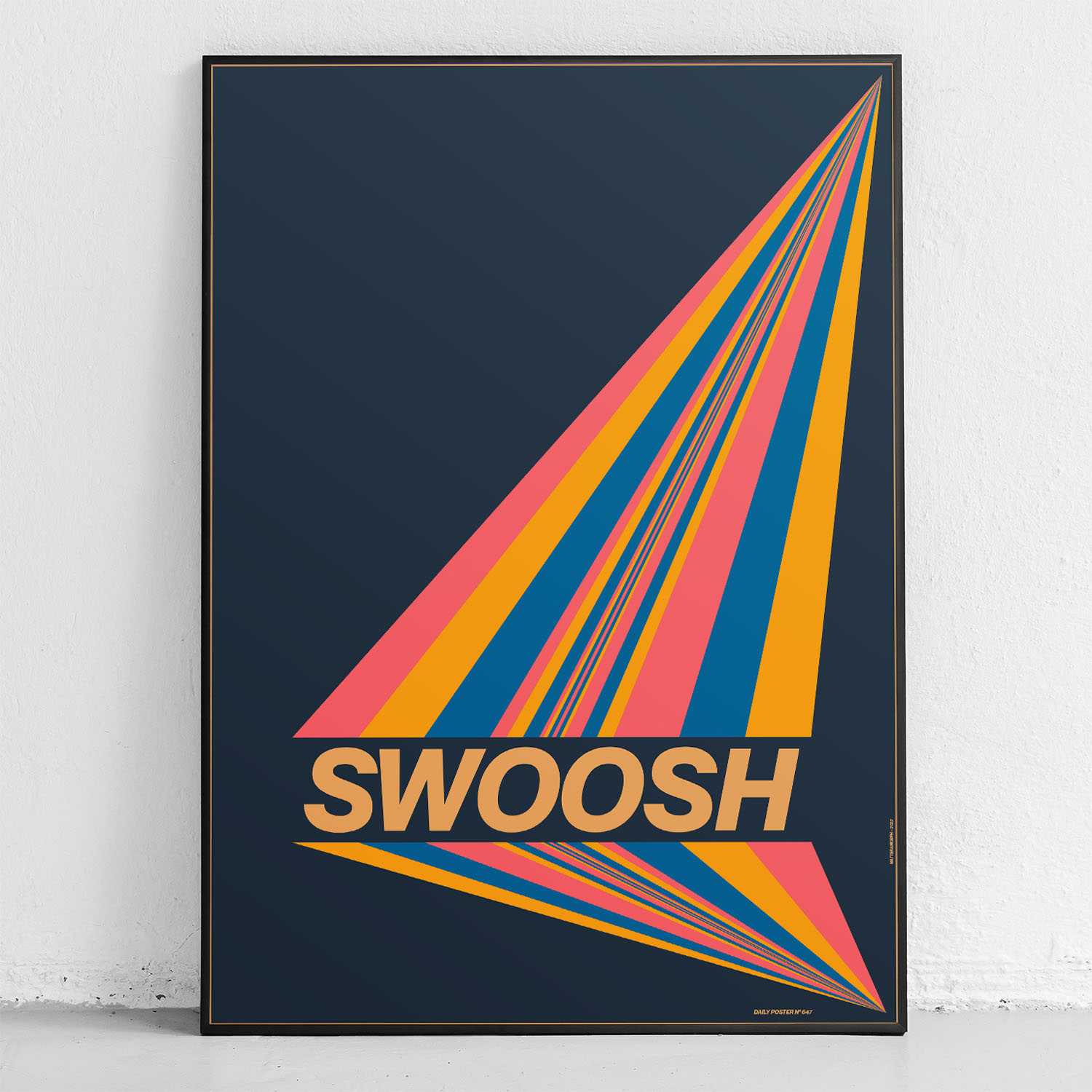 framed poster "swooosh" in front of wall